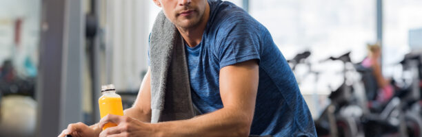 Fit man with energy drink